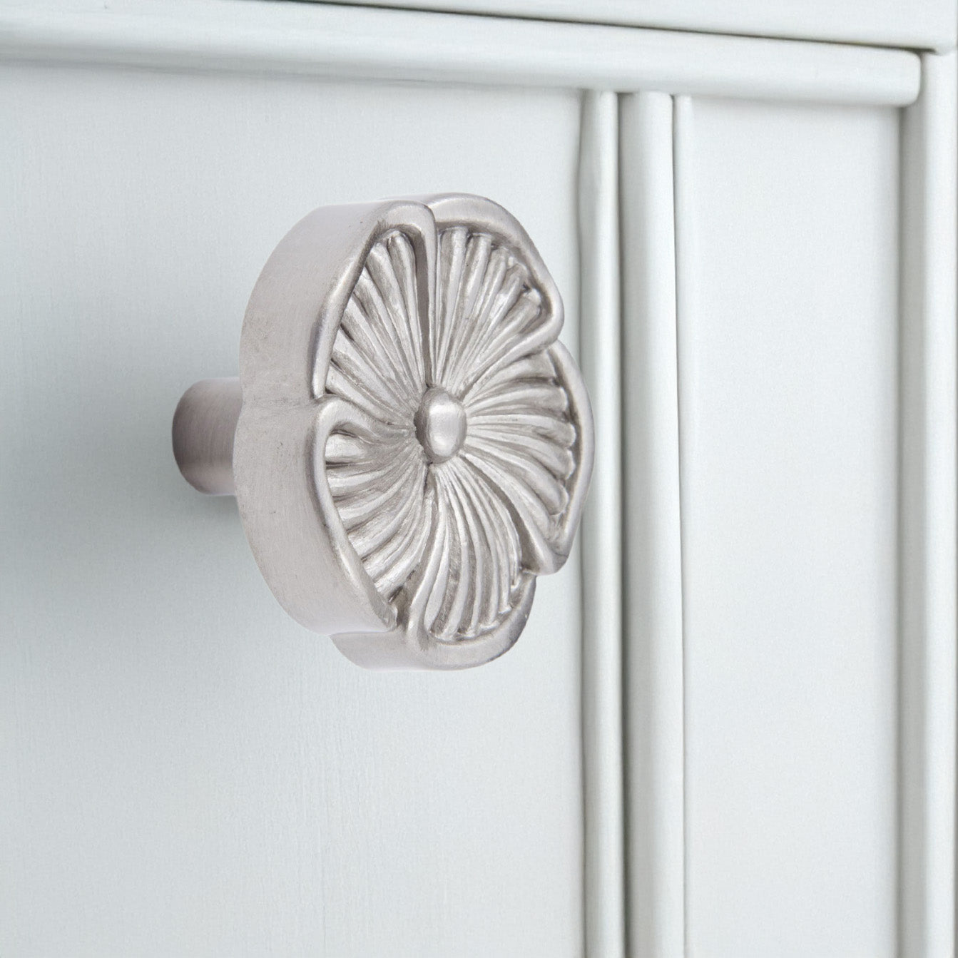 Silver Flower Knob on White Cabinet